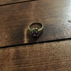 Amethyst gold ring with swirl design onside.3 small accent diamonds. Size 6
